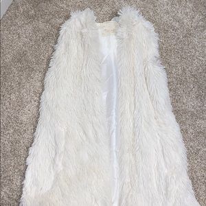 White fur vest